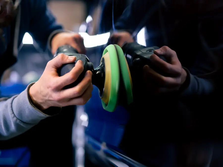 Machine polishing a vehicle&rsquo;s paint during an exterior detail